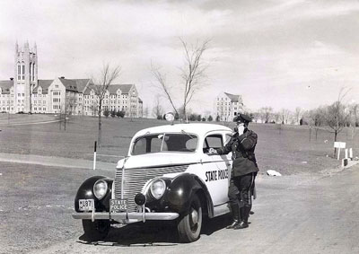 CT State Police Officeer and car from the 1900s